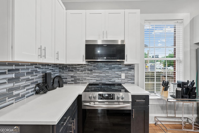 50 Ormond St SW, Atlanta, GA 30315 - kitchen with stainless steel appliances, white cabinetry, light countertops, and tasteful backsplash