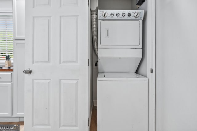 50 Ormond St SW, Atlanta, GA 30315 - laundry room featuring stacked washer / dryer and wood finished floors
