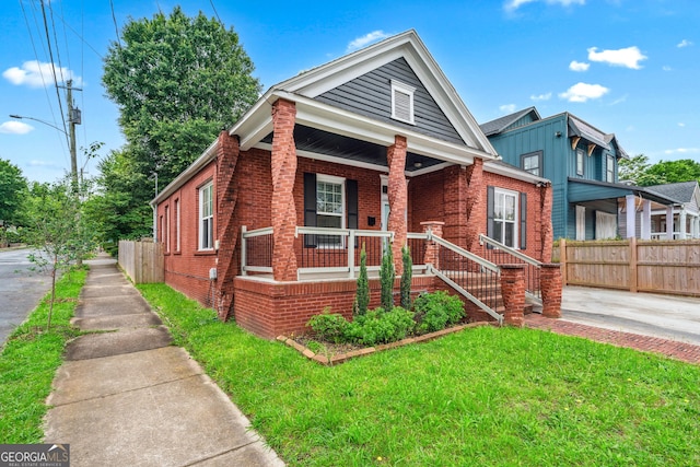 50 Ormond St SW, Atlanta, GA 30315 - view of front of house featuring brick siding and covered porch