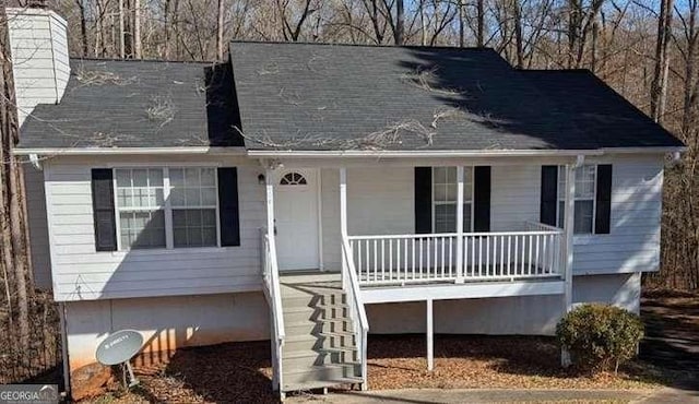 1668 Independence Dr, Douglasville, GA 30134 - view of front of property with a porch, a chimney, and stairway