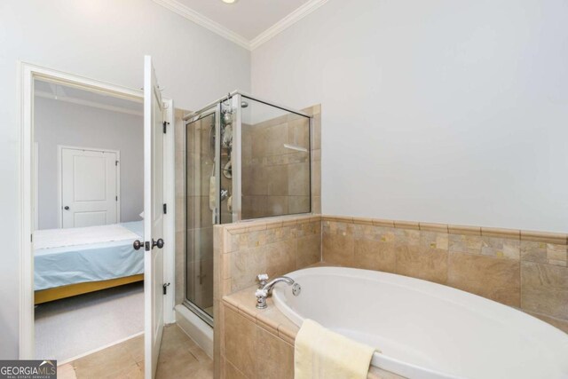 11 Perimeter Ctr E Unit 1412, Atlanta, GA 30346 - ensuite bathroom with a bath, ornamental molding, a shower stall, and tile patterned floors