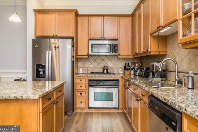 11 Perimeter Ctr E Unit 1412, Atlanta, GA 30346 - kitchen featuring stainless steel appliances, ornamental molding, brown cabinets, light stone countertops, and backsplash