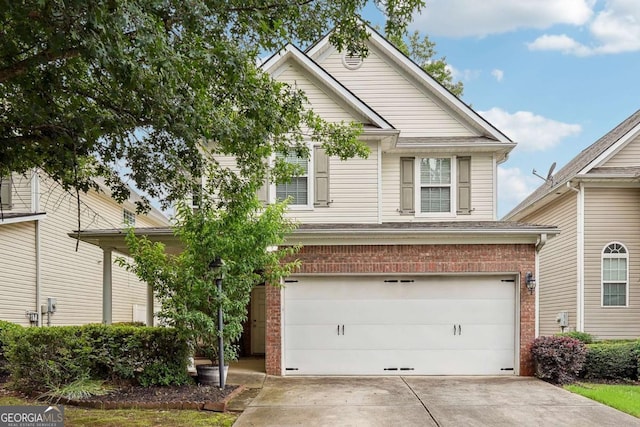 2545 Gatewater Ct, Cumming, GA 30040 - view of front of house with a garage, brick siding, and driveway