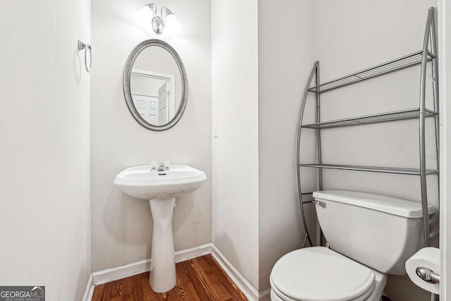 2545 Gatewater Ct, Cumming, GA 30040 - half bathroom with wood finished floors, toilet, and baseboards
