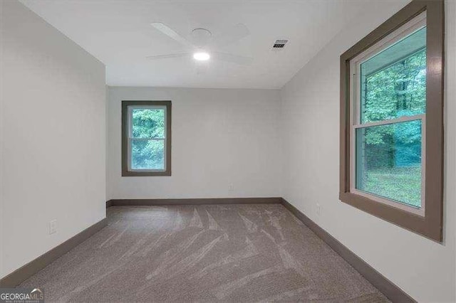 327 Marty Ln, Dallas, GA 30132 - carpeted spare room with baseboards and a ceiling fan