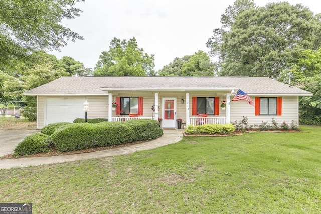 213 Feagin Mill Rd, Warner Robins, GA 31088 - ranch-style home featuring covered porch, a garage, driveway, a front yard, and roof with shingles