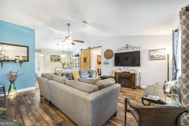 213 Feagin Mill Rd, Warner Robins, GA 31088 - living area with a barn door, dark wood-style flooring, ceiling fan, baseboards, and lofted ceiling