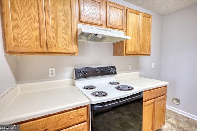 5587 Strathmoor Manor Cir, Lithonia, GA 30058 - kitchen featuring white range with electric cooktop, under cabinet range hood, light countertops, and a textured ceiling