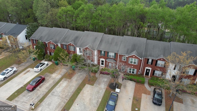5587 Strathmoor Manor Cir, Lithonia, GA 30058 - aerial view of residential area featuring a heavily wooded area