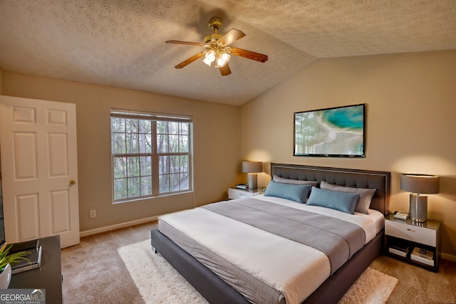 5587 Strathmoor Manor Cir, Lithonia, GA 30058 - carpeted bedroom with baseboards, vaulted ceiling, a textured ceiling, and ceiling fan
