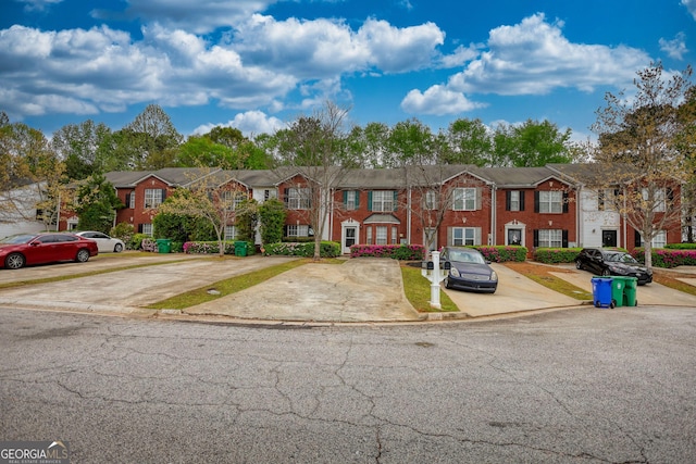 5587 Strathmoor Manor Cir, Lithonia, GA 30058 - view of property with uncovered parking and a residential view