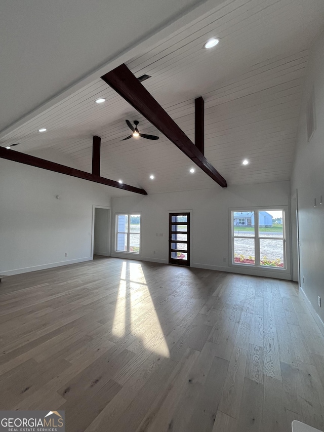 1365 Paris, Swainsboro, GA 30401 - unfurnished living room with baseboards, light wood finished floors, recessed lighting, beam ceiling, and high vaulted ceiling