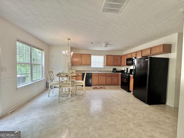 105 Avonwood Cir, Locust Grove, GA 30248 - kitchen with black appliances, a sink, a chandelier, and plenty of natural light