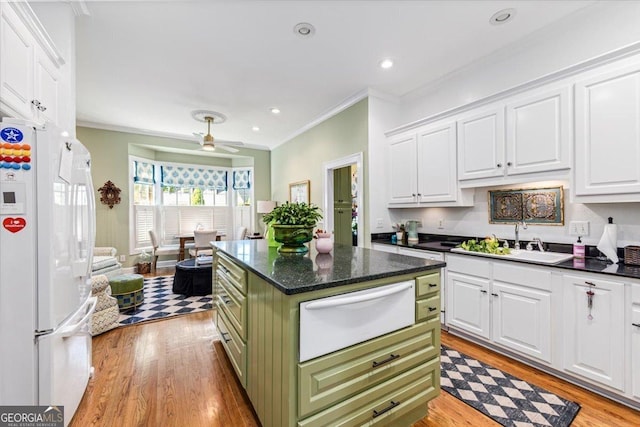 116 Maimont Cir, Macon, GA 31210 - kitchen featuring freestanding refrigerator, a warming drawer, green cabinets, white cabinets, and crown molding