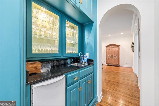 116 Maimont Cir, Macon, GA 31210 - indoor wet bar with white dishwasher, arched walkways, light wood-type flooring, and ornamental molding