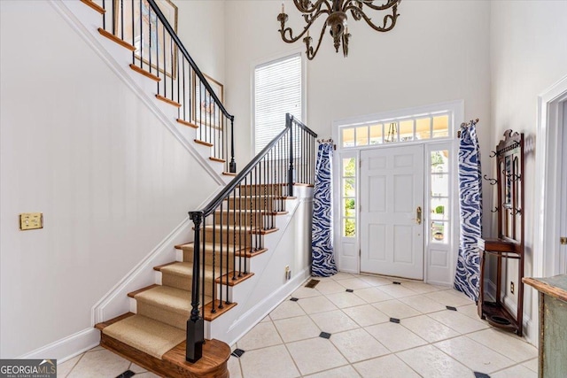 116 Maimont Cir, Macon, GA 31210 - entryway featuring a high ceiling, stairs, light tile patterned floors, and a chandelier
