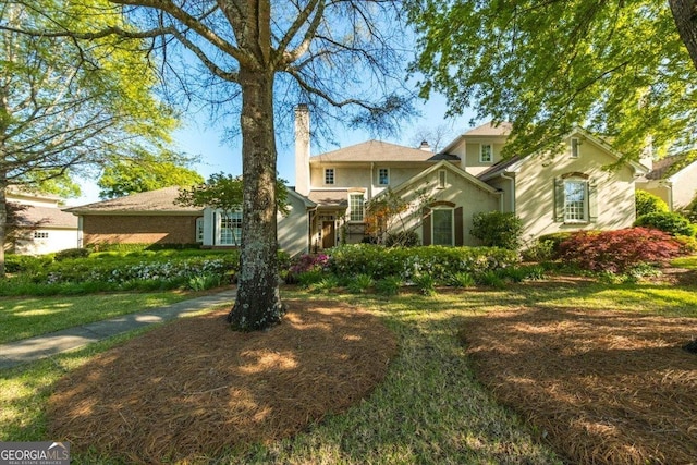116 Maimont Cir, Macon, GA 31210 - view of front of property with a chimney, stucco siding, and a front yard