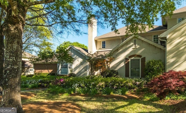 116 Maimont Cir, Macon, GA 31210 - rear view of house featuring a chimney and stucco siding