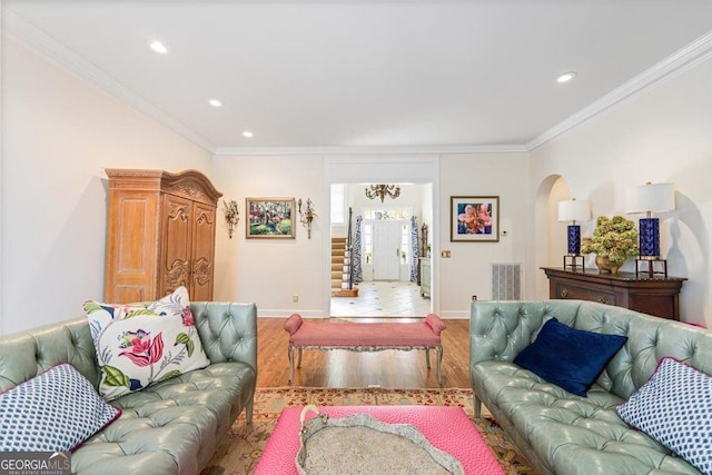 116 Maimont Cir, Macon, GA 31210 - living area with light wood-type flooring, arched walkways, crown molding, recessed lighting, and a chandelier