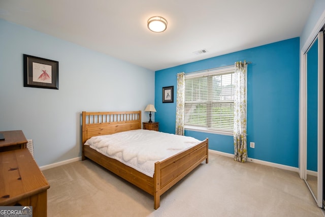 199 Eastham Ct, Suwanee, GA 30024 - bedroom featuring light colored carpet, baseboards, and a closet