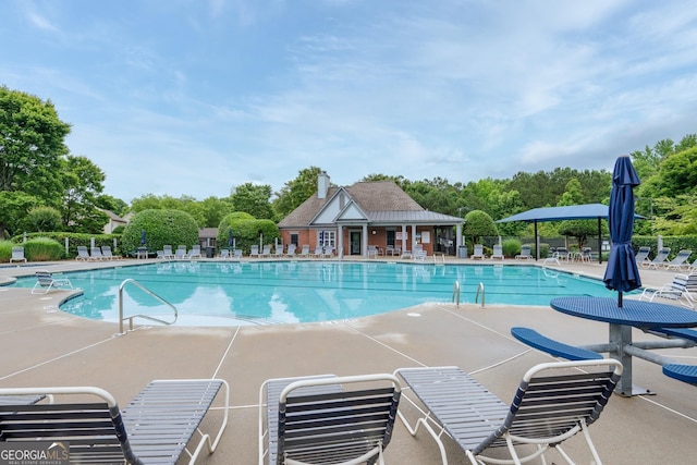 199 Eastham Ct, Suwanee, GA 30024 - community pool with a patio and view of scattered trees