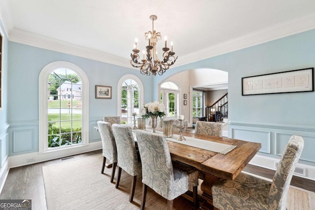 100 Pine Mist Cir, Alpharetta, GA 30022 - dining room featuring arched walkways, a chandelier, wood finished floors, stairs, and crown molding
