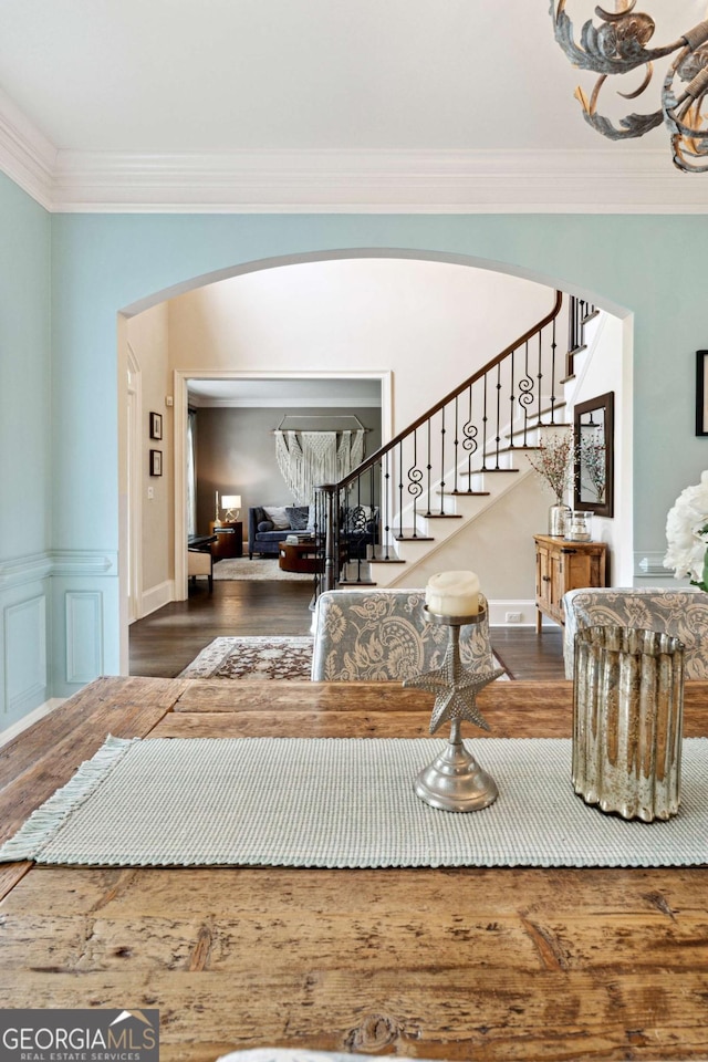 100 Pine Mist Cir, Alpharetta, GA 30022 - foyer entrance featuring arched walkways, crown molding, stairs, wood finished floors, and baseboards