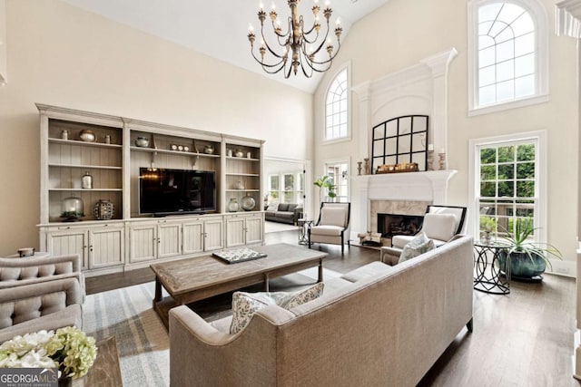 100 Pine Mist Cir, Alpharetta, GA 30022 - living area with high vaulted ceiling, a fireplace, dark wood-style floors, and a chandelier
