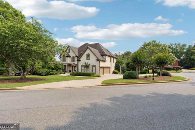 100 Pine Mist Cir, Alpharetta, GA 30022 - view of front of property featuring driveway, a garage, stucco siding, and a front lawn