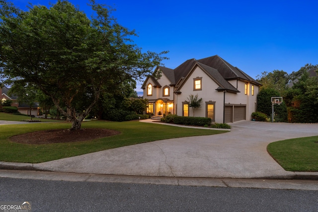 100 Pine Mist Cir, Alpharetta, GA 30022 - french provincial home featuring stucco siding, an attached garage, a front yard, and driveway