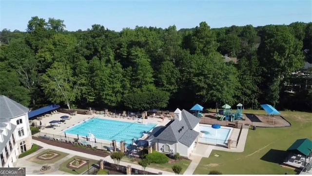 100 Pine Mist Cir, Alpharetta, GA 30022 - drone / aerial view of a pool and a heavily wooded area