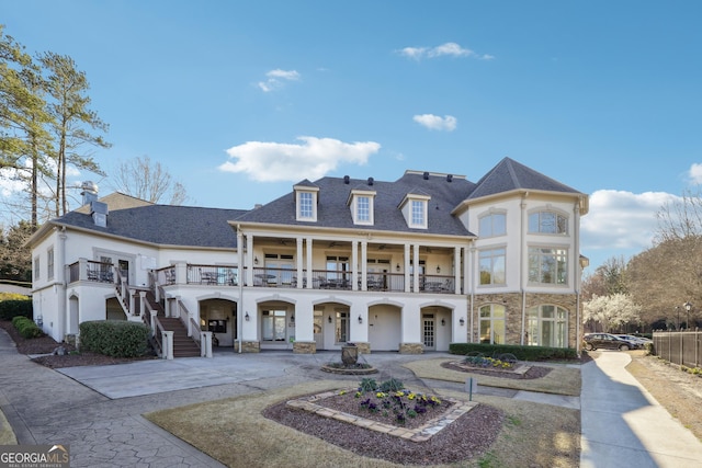100 Pine Mist Cir, Alpharetta, GA 30022 - back of house featuring driveway, stone siding, stairway, and stucco siding