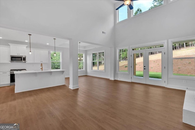 3 Rushden Way SE, Rome, GA 30161 - unfurnished living room featuring ceiling fan, dark wood-style floors, recessed lighting, and a high ceiling
