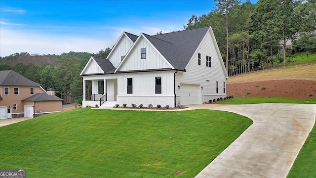 3 Rushden Way SE, Rome, GA 30161 - modern inspired farmhouse featuring board and batten siding, an attached garage, driveway, covered porch, and a front yard