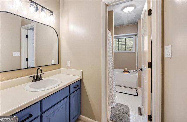 6121 Peake Rd, Macon, GA 31220 - bathroom with vanity and baseboards