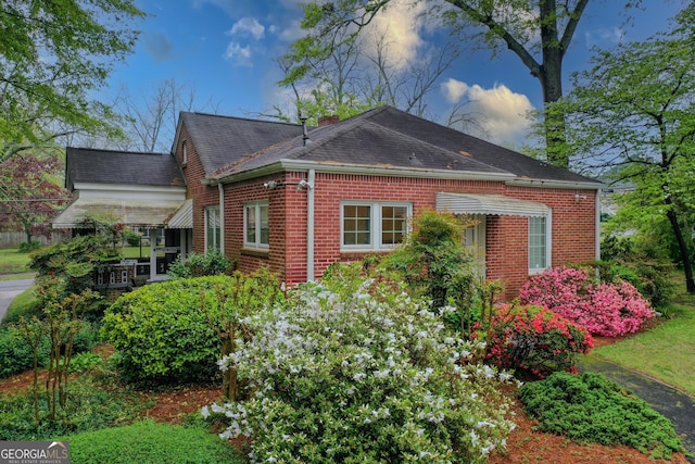 109 Stockbridge Rd, Jonesboro, GA 30236 - view of side of property with brick siding and roof with shingles