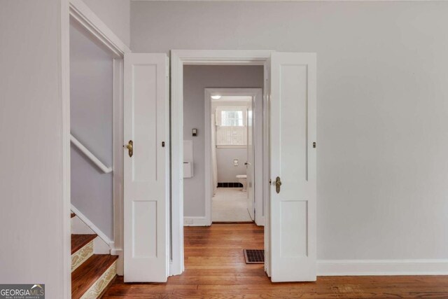 170 Stanton Way, Athens, GA 30606 - hallway featuring wood finished floors, baseboards, and stairs