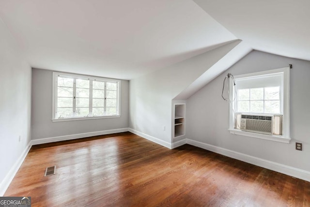 170 Stanton Way, Athens, GA 30606 - additional living space featuring plenty of natural light, wood finished floors, built in features, vaulted ceiling, and cooling unit