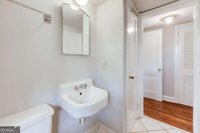 170 Stanton Way, Athens, GA 30606 - half bathroom featuring toilet, baseboards, a sink, and tile patterned flooring