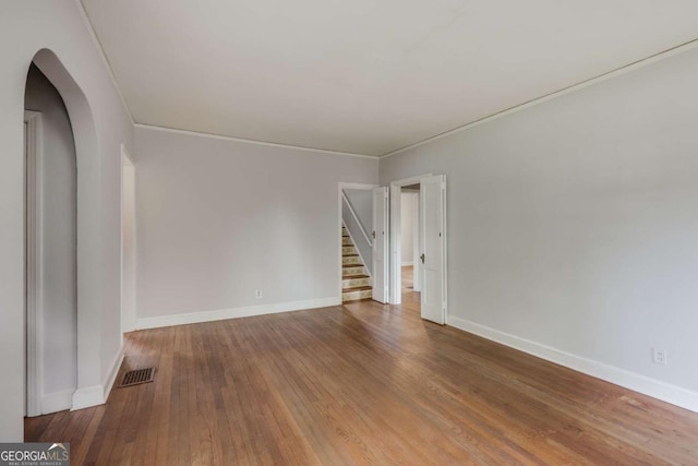 170 Stanton Way, Athens, GA 30606 - unfurnished room with hardwood / wood-style floors, arched walkways, stairs, and ornamental molding