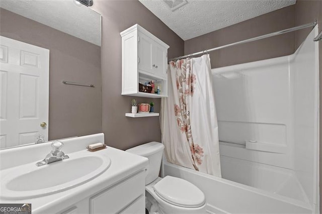 1865 Morgans Run Trl, Buford, GA 30519 - bathroom with a textured ceiling, vanity, and shower / bath combo with shower curtain
