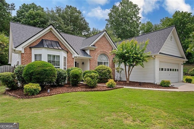 1865 Morgans Run Trl, Buford, GA 30519 - view of front of home with concrete driveway, a shingled roof, and brick siding