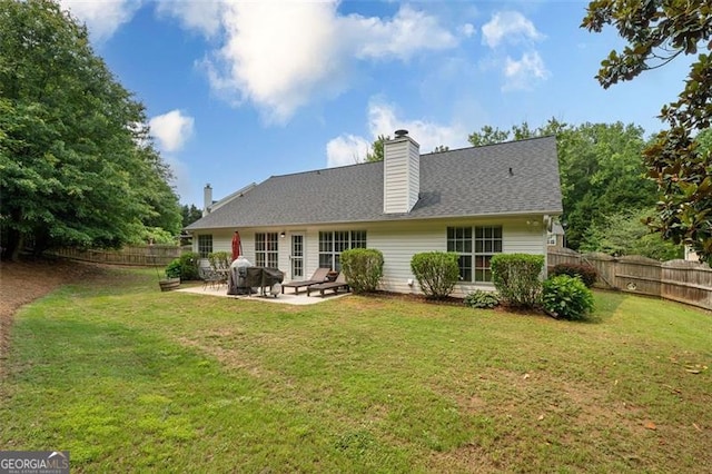 1865 Morgans Run Trl, Buford, GA 30519 - rear view of property with a patio, a fenced backyard, a chimney, and a shingled roof