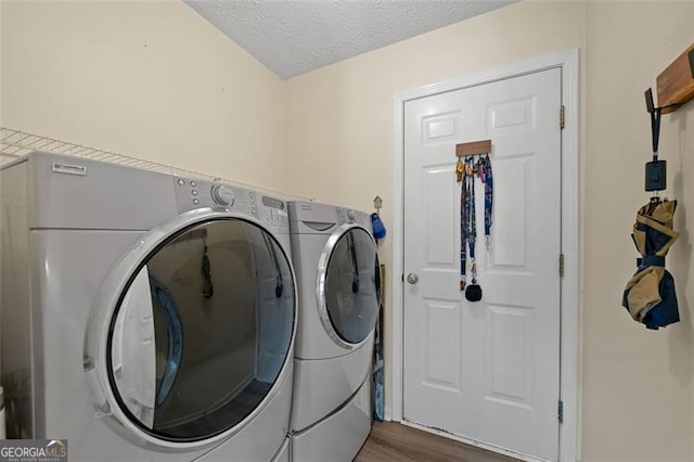 1865 Morgans Run Trl, Buford, GA 30519 - washroom with independent washer and dryer, wood finished floors, and a textured ceiling