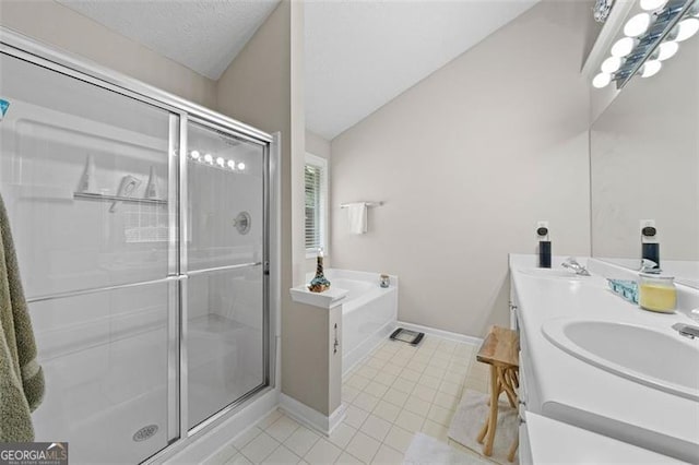 1865 Morgans Run Trl, Buford, GA 30519 - full bath with tile patterned flooring, a stall shower, a bath, double vanity, and lofted ceiling