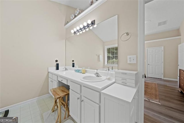 1865 Morgans Run Trl, Buford, GA 30519 - bathroom featuring double vanity and baseboards