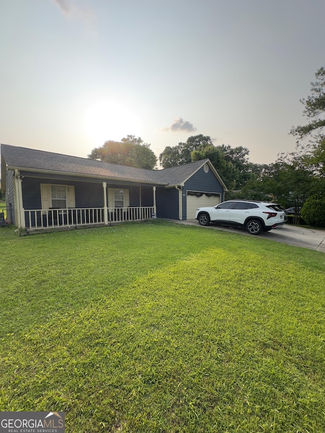 6403 Heritage Run, Morrow, GA 30260 - view of front facade featuring a garage, a yard, covered porch, and concrete driveway