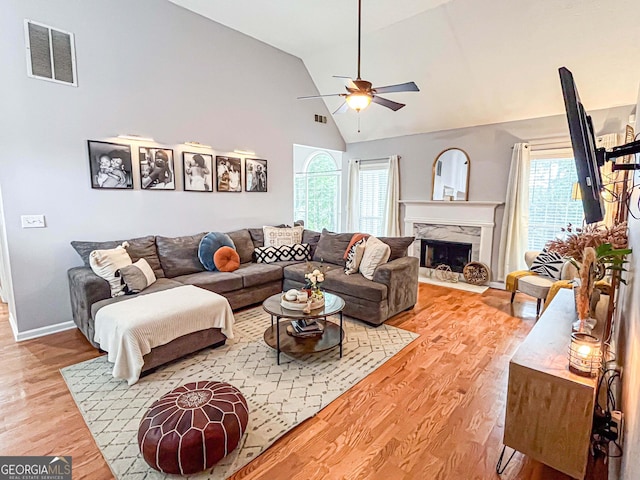 329 Royal Crescent Way, Stockbridge, GA 30281 - living area with a ceiling fan, wood finished floors, plenty of natural light, high vaulted ceiling, and a high end fireplace