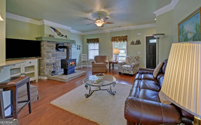 60 Villa Cts, Hartwell, GA 30643 - living area featuring a wood stove, a ceiling fan, crown molding, wood finished floors, and baseboards