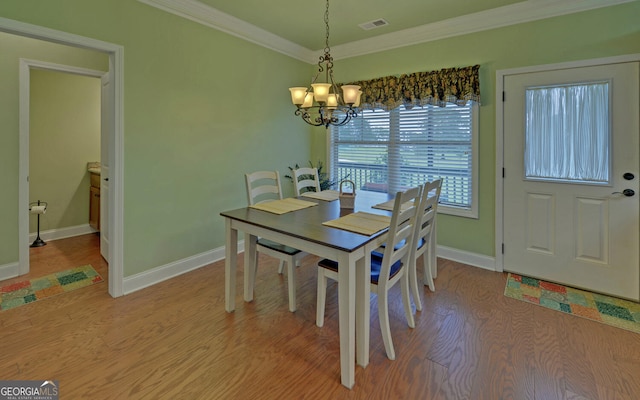 60 Villa Cts, Hartwell, GA 30643 - dining room with a chandelier, crown molding, baseboards, and light wood-type flooring